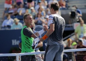 Lleyton Hewitt of Australia congratulates Tomas Berdych of the Czech Republic after their match at the 2014 U.S. Open tennis tournament in New York